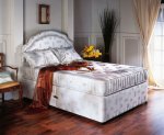 Shakespeare Tempest double divan bed with matching padded headboard.