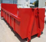 Large open red skip for waste removal.