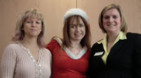 Three ladies at a Crewe 4N meeting near Christmas, the lady in the middle has on a sexy santa suit.
