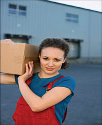 Young lady showing how to correctly carry a box on her shoulder.