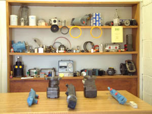 Service Counter, showing a selection of hydraulic arms, rams, motors seals and PTO pumps.