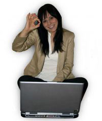 Image of smiling lady sat cross-legged on floor in front of her open laptop, smiling and giving the OK sign. She is happy to have a business idea, but where does she get help?