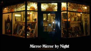 Mirror-Mirror shop front by night. Mirrors for every 
room in the house, and any room at the office .