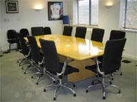 Boardroom style room with chairs, professional office.