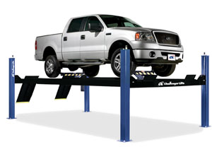 Four post lift with pick-up truck.