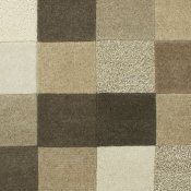 Rug consisting of squares in natural colours.